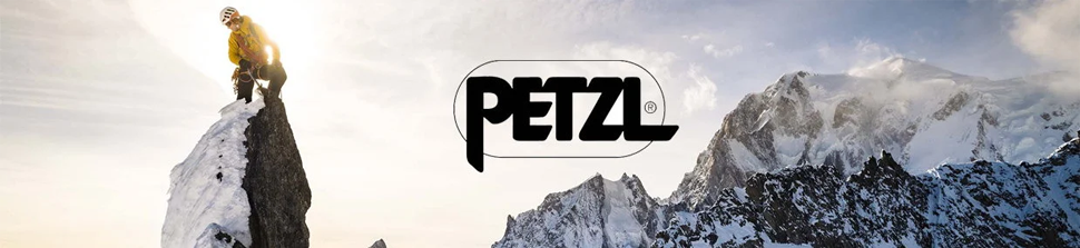 Bannière Petzl image de la marque avec vue sur la montagne enneigée et un alpiniste portant les équipements Petzl